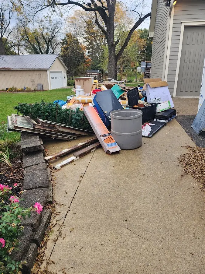 Dumpster being loaded with debris for 3 Yard Dumpster Rental in Gainesville